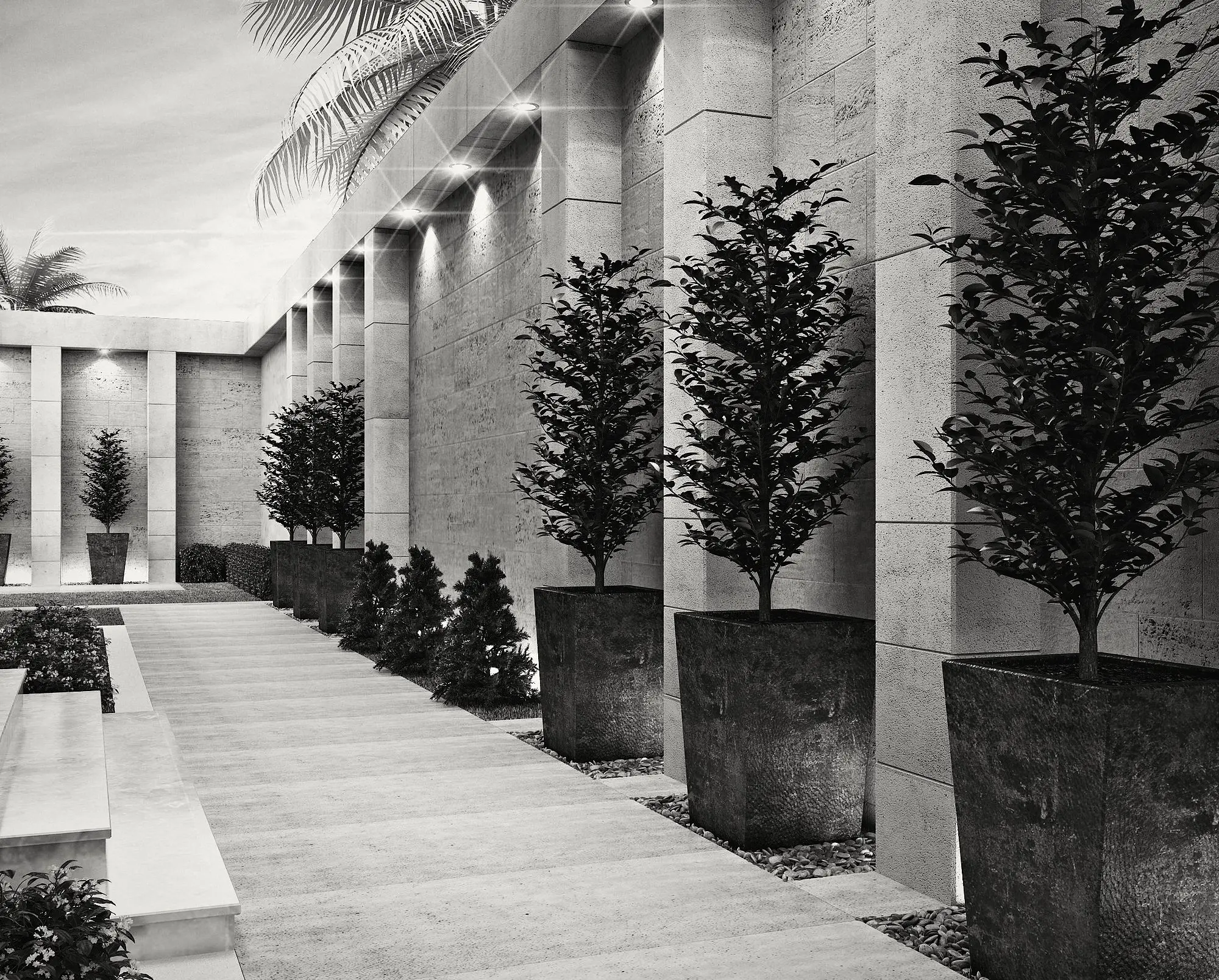 The garden walk: trees in planters along the stone wall.